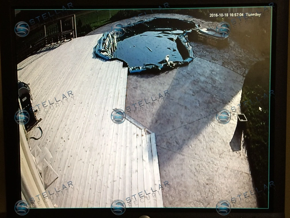 Live security camera monitor view monitoring custom backyard deck and swimming pool in Cambridge