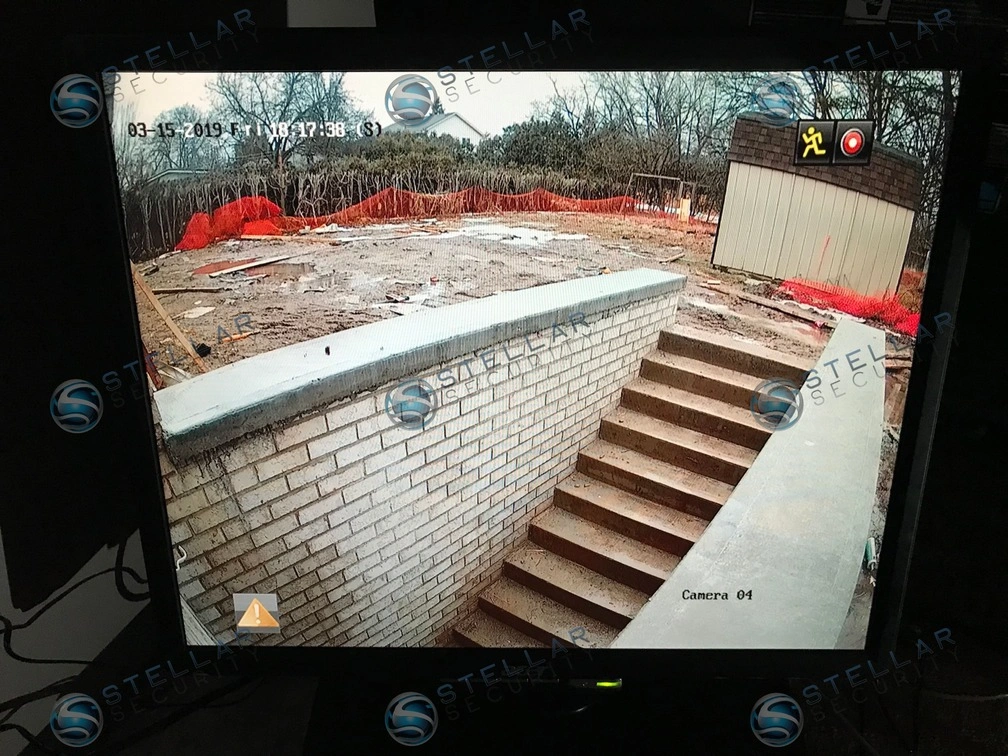 Live 4K security camera feed displayed on monitor showing exterior residential view in Mississauga