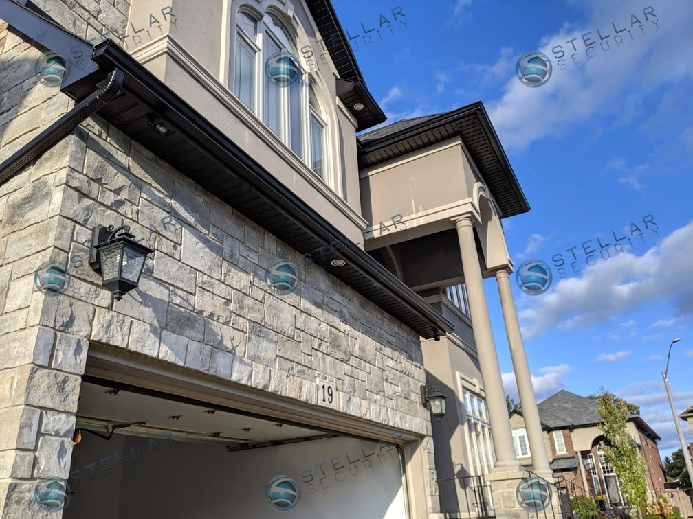 Wide-angle view of front exterior soffit camera installed on Toronto luxury home