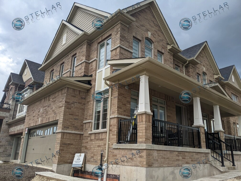 Two-story brick detached home in Kitchener during security camera system installation