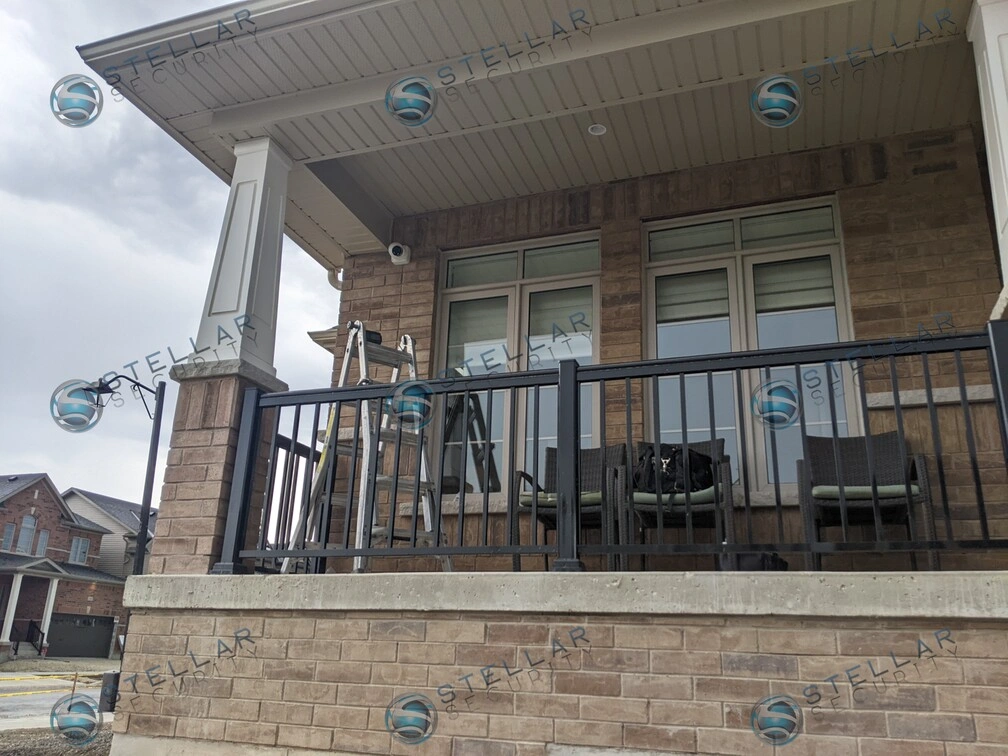Front porch balcony railing and soffit overhang prepared for security camera placement in Kitchener