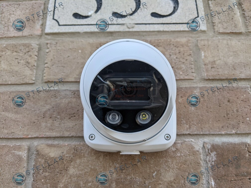 Frontal close-up of white 4K outdoor turret security camera with dual infrared LEDs in Kitchener