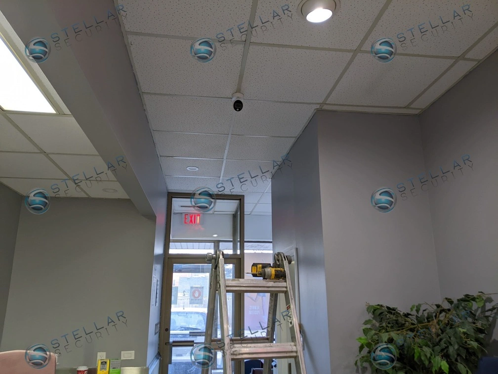 Drop-ceiling mini dome camera installed in a school main entrance foyer.