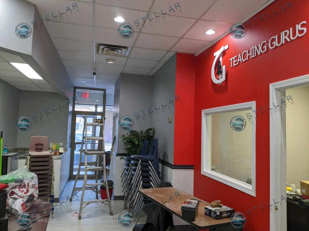 Interior front office of a learning facility featuring drop-ceiling commercial security cameras.